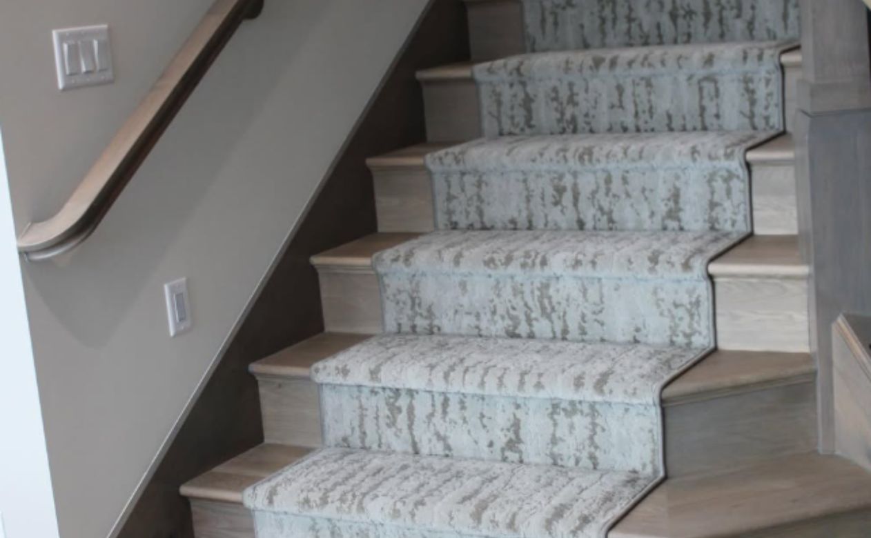 grey and white patterned stair runner in a Bountiful, UT, home installed by Mike & Sterling's Flooring America