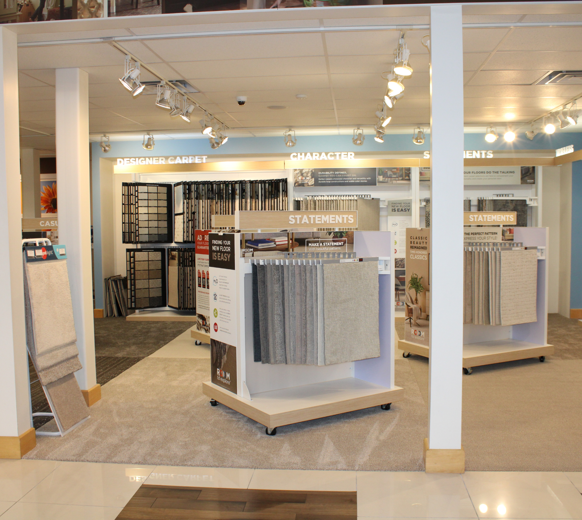 Women holding flooring sample in floor store 